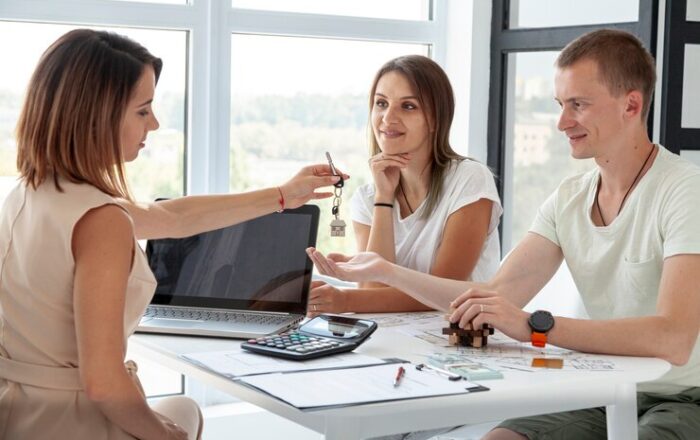 couple-accepting-keys-their-new-house_23-2148346270